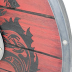 Detailaufnahme eines echten, schaukampftauglichen Wikinger-Schildes in Rot-Schwarz mit Wolfsmotiv – handgefertigt aus Holz, mit Aluminium-Schildbuckel und stabilem Metallrahmen.